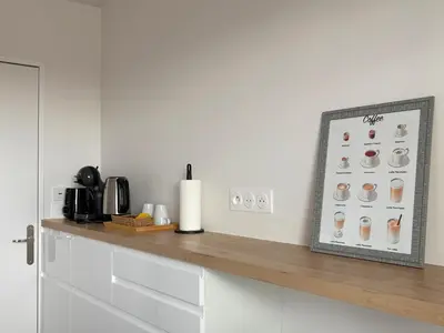Cuisine ou kitchenette dans l'établissement Dans le 19ème de Paris avec vue sur toute la ville