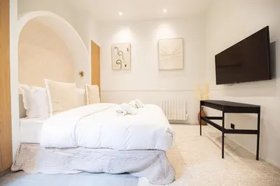 Un ou plusieurs lits dans un hébergement de l'établissement Cozy studio - upper Marais
