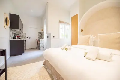 Un ou plusieurs lits dans un hébergement de l'établissement Cozy studio - upper Marais