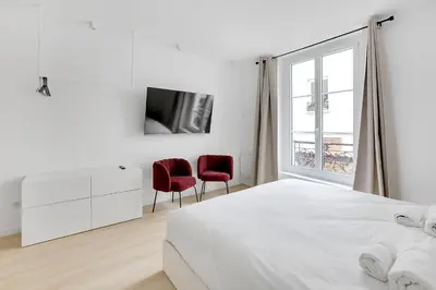 Un ou plusieurs lits dans un hébergement de l'établissement Studio cosy & élégant au cœur de Paris