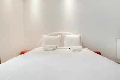 Un ou plusieurs lits dans un hébergement de l'établissement Studio cosy & élégant au cœur de Paris