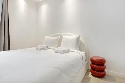 Un ou plusieurs lits dans un hébergement de l'établissement Studio cosy & élégant au cœur de Paris