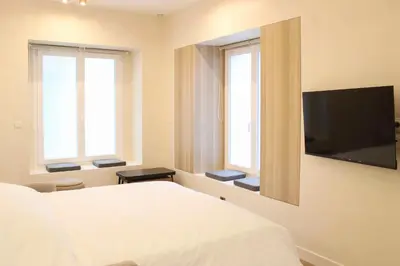 Télévision ou salle de divertissement dans l'établissement Chaumont Paris Suite