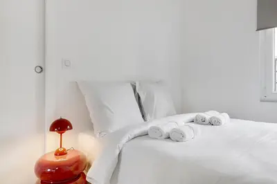 Un ou plusieurs lits dans un hébergement de l'établissement Charmant appartement central & lumineux