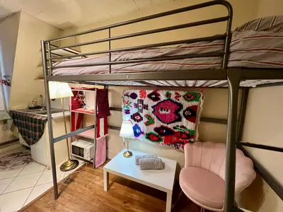 Un ou plusieurs lits dans un hébergement de l'établissement Paris center Eiffel studio