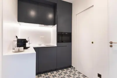 Cuisine ou kitchenette dans l'établissement Louvre élégance appartements de charme