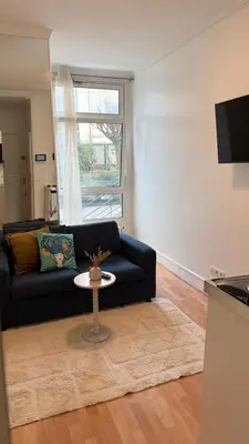 Télévision ou salle de divertissement dans l'établissement Cosy et moderne