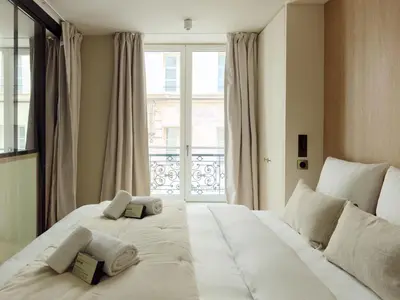 Un ou plusieurs lits dans un hébergement de l'établissement Maison Marais