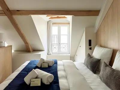Un ou plusieurs lits dans un hébergement de l'établissement Luxury Flat in Le Marais