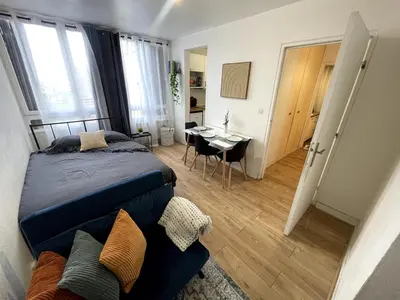 Un ou plusieurs lits dans un hébergement de l'établissement Modern studio for 3, Porte de Paris nord metro 7