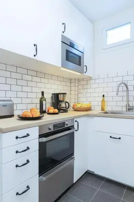 Cuisine ou kitchenette dans l'établissement Appartement au cœur du 16e, proche Tour Eiffel
