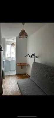 Un ou plusieurs lits dans un hébergement de l'établissement Chambre au pied de la Tour Eiffel