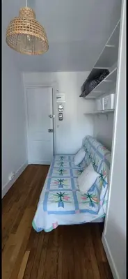 Un ou plusieurs lits dans un hébergement de l'établissement Chambre au pied de la Tour Eiffel