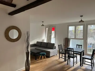 Coin salon dans l'établissement Appartement Paris 19