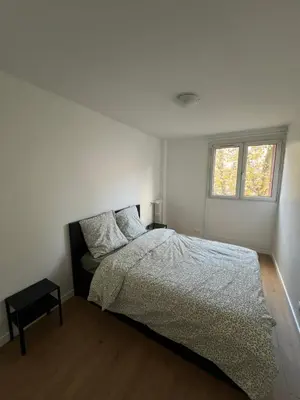 Un ou plusieurs lits dans un hébergement de l'établissement Appartement Paris 19