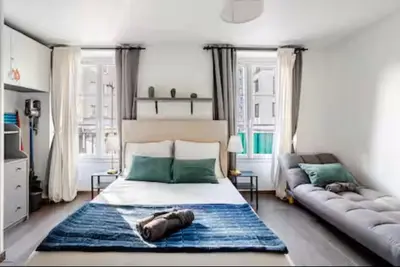 Un ou plusieurs lits dans un hébergement de l'établissement Studio type chambre d'hôtel - Proche Gare de Lyon