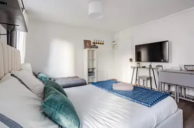 Un ou plusieurs lits dans un hébergement de l'établissement Studio type chambre d'hôtel - Proche Gare de Lyon
