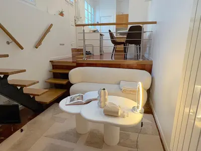 Coin salon dans l'établissement Le Loft Mont-Cenis