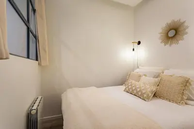 Un ou plusieurs lits dans un hébergement de l'établissement Cosy flat 3P- Le Marais 2