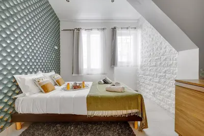 Un ou plusieurs lits dans un hébergement de l'établissement 129 Dilana - Charming Apartment Near République