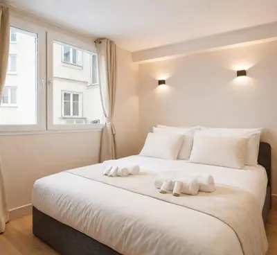 Un ou plusieurs lits dans un hébergement de l'établissement Montmartre - Deluxe studio with lift for 4