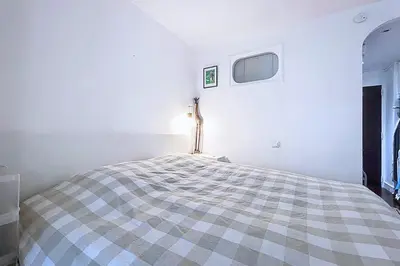 Un ou plusieurs lits dans un hébergement de l'établissement Studio 30 m avec balcon proche Roland Garros