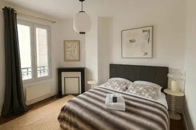 Un ou plusieurs lits dans un hébergement de l'établissement Charmant appartement Paris 12 pour 4 personnes