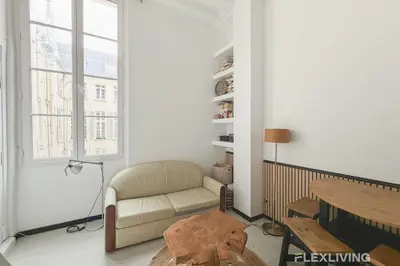 Coin salon dans l'établissement Charmant studio dans Paris 04ème
