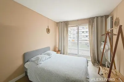 Un ou plusieurs lits dans un hébergement de l'établissement Idéal studio dans Paris 05ème