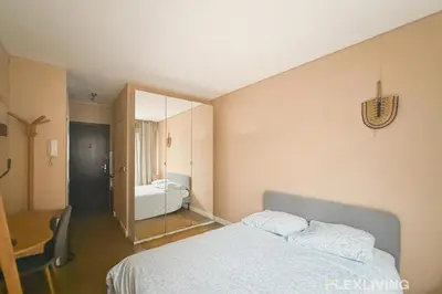 Un ou plusieurs lits dans un hébergement de l'établissement Idéal studio dans Paris 05ème