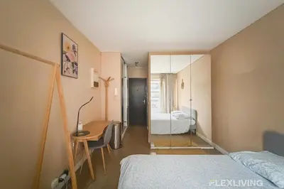 Un ou plusieurs lits dans un hébergement de l'établissement Idéal studio dans Paris 05ème