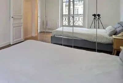 Un ou plusieurs lits dans un hébergement de l'établissement paris house 15