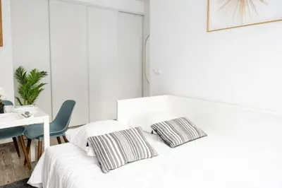 Un ou plusieurs lits dans un hébergement de l'établissement Bel appartement parisien