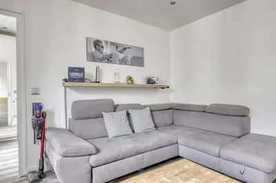 Coin salon dans l'établissement Le Pajol - Appartement Paris 18eme