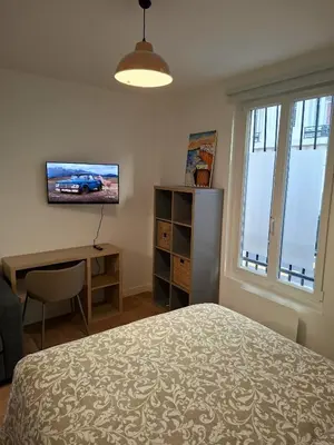 Télévision ou salle de divertissement dans l'établissement Cosy Montmartre Apartment
