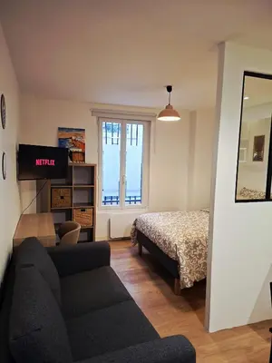 Un ou plusieurs lits dans un hébergement de l'établissement Cosy Montmartre Apartment