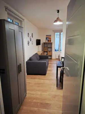 Télévision ou salle de divertissement dans l'établissement Cosy Montmartre Apartment