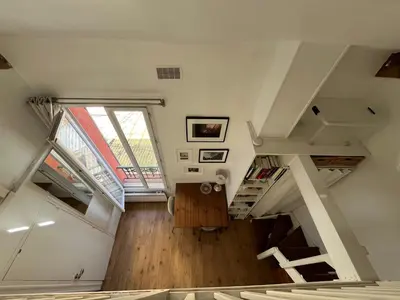 Un ou plusieurs lits dans un hébergement de l'établissement Joli petit duplex lumineux et au calme