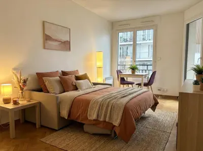 Un ou plusieurs lits dans un hébergement de l'établissement Le Petit Cocon - Cosy - Terrasse - Centre Ville - 2 personnes