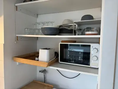 Cuisine ou kitchenette dans l'établissement Le Petit Cocon - Cosy - Terrasse - Centre Ville - 2 personnes
