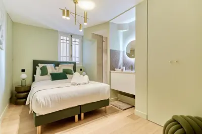 Un ou plusieurs lits dans un hébergement de l'établissement Grand Duplex - Arc de Triomphe
