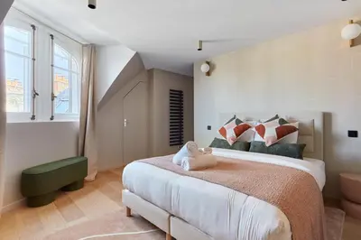 Un ou plusieurs lits dans un hébergement de l'établissement Grand Duplex - Arc de Triomphe