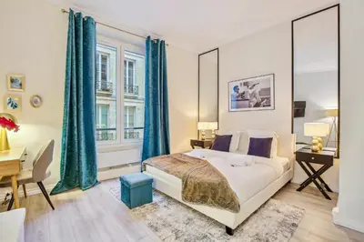 Un ou plusieurs lits dans un hébergement de l'établissement Place des Vosges - Marais - Prime Location