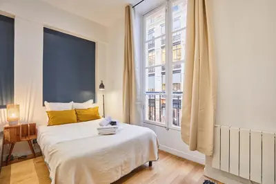 Un ou plusieurs lits dans un hébergement de l'établissement Charming & Modern Studio Center of Paris