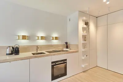 Cuisine ou kitchenette dans l'établissement Sublim apartment Montaigne-Eiffel Tower