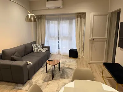 Coin salon dans l'établissement Charmant appartement avec chambre cosy et canapé convertible