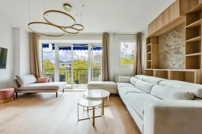 Coin salon dans l'établissement Bel appartement avec clim - Neuilly-sur-Seine