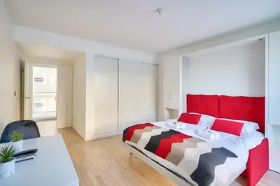 Un ou plusieurs lits dans un hébergement de l'établissement Bel appartement avec balcon