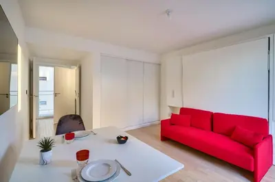 Coin salon dans l'établissement Bel appartement avec balcon