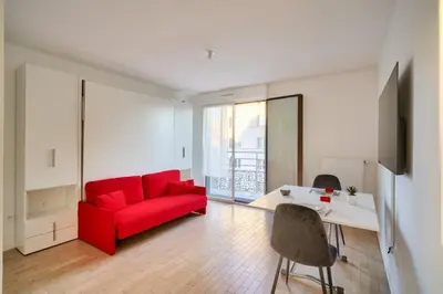 Coin salon dans l'établissement Bel appartement avec balcon